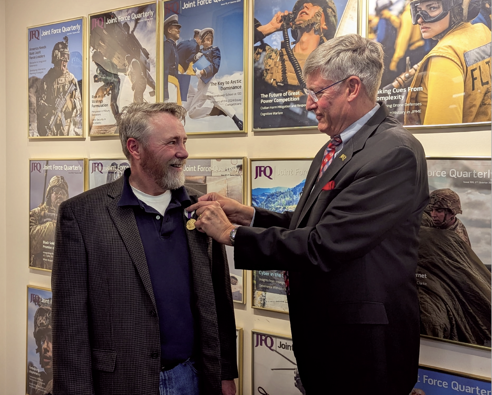 Dr. Jeffrey D. Smotherman (left) receiving the Joint Distinguished Civilian Service Award from Dr. William T. Eliason.